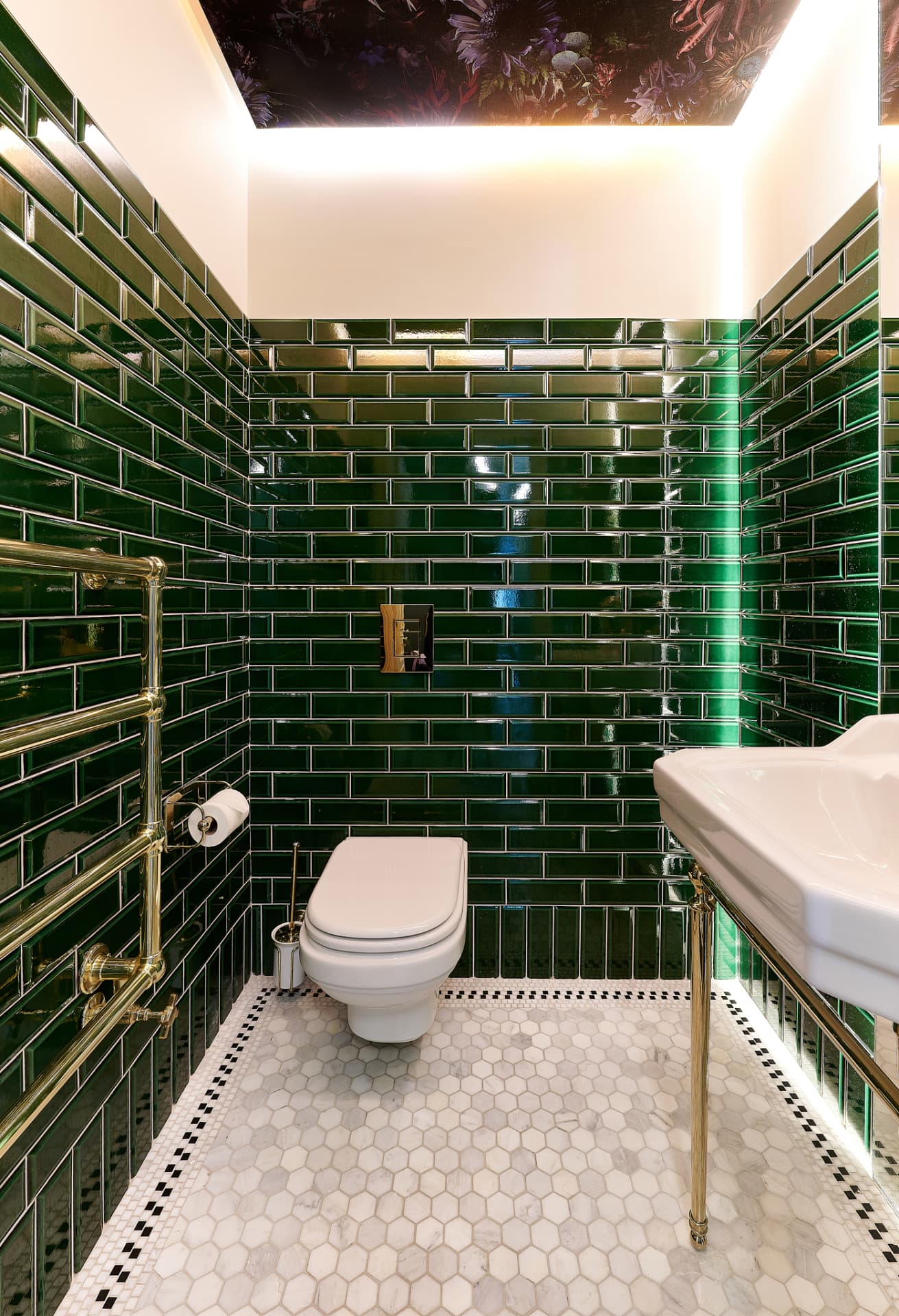 The Townhouse — cloakroom in emerald tile with brass fittings and floral painted ceiling