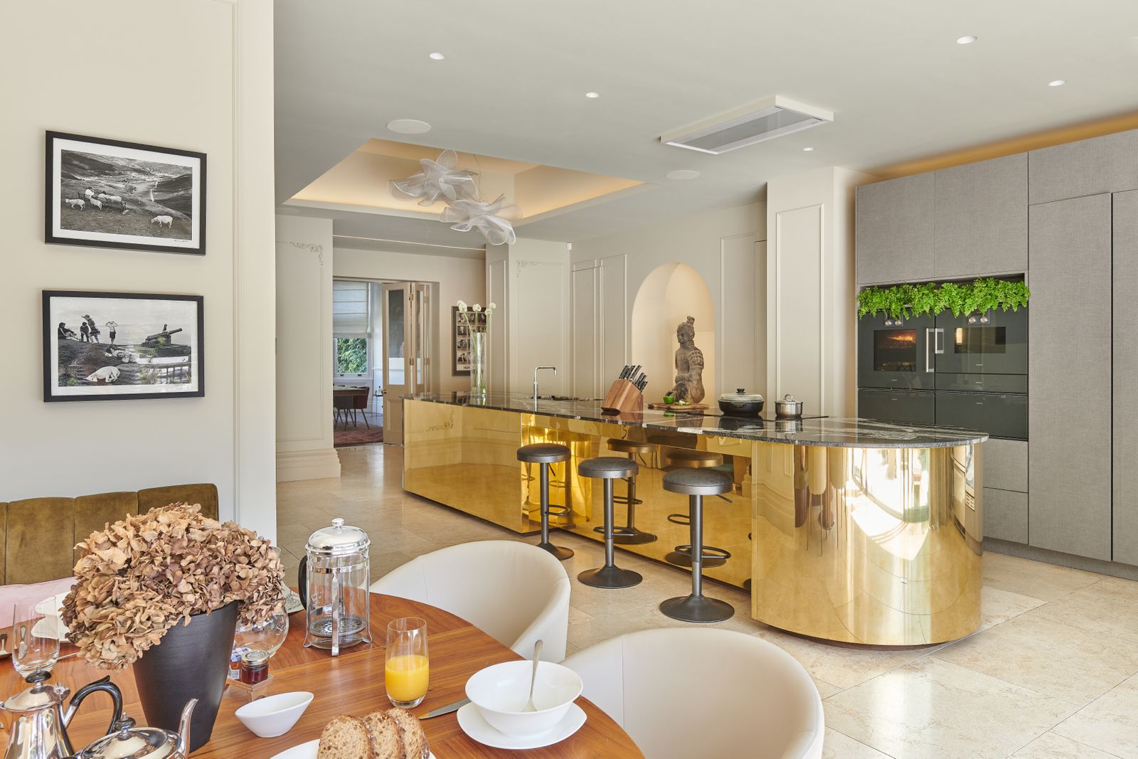 The Residence — brass island kitchen with Skyfall stone