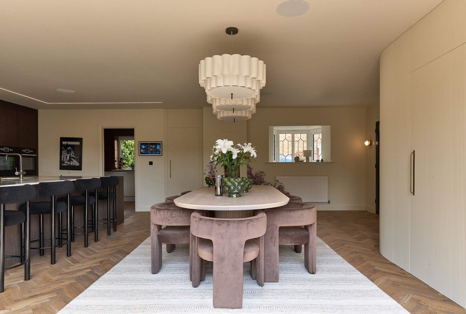 The Muse — dining room with sculptural chandelier