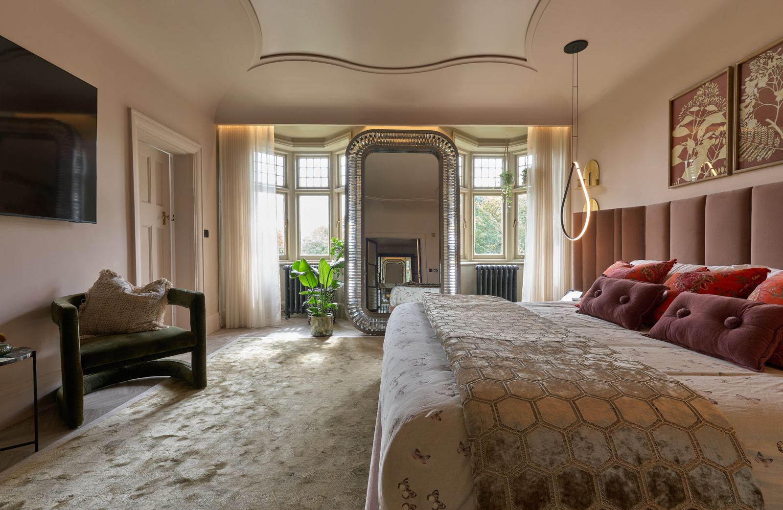 The House on the Park — bedroom with bay window, fluted mirror and blush upholstery