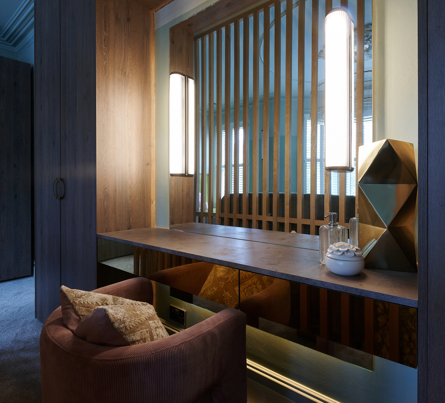 The Townhouse — dressing table set into a fluted oak niche with alabaster wall lights
