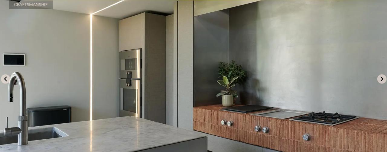 Dark timber kitchen with illuminated open shelving