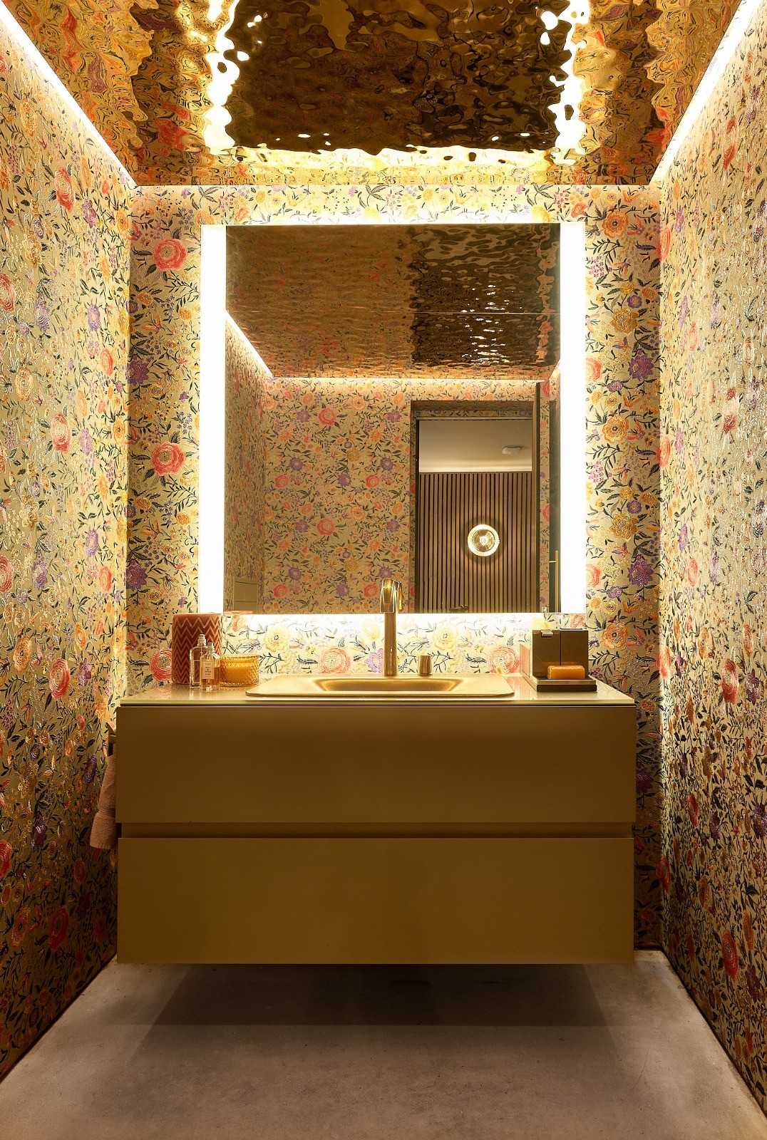 Floral, brass and hand-honed stone.